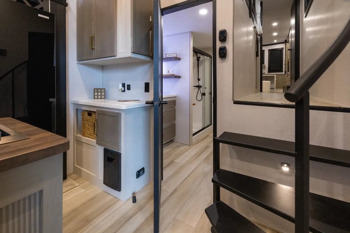 Kitchen leading to bathroom and front hall
